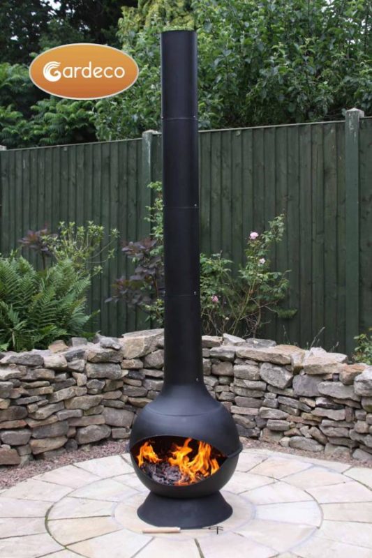 Kaska Cast Iron and Steel Chiminea with fire in garden